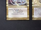 two cards that are sitting on a table