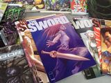 a lot of comic books on the table