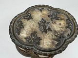 a silver box sitting on top of a white table