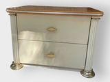 a silver chest of drawers with a wooden top on a white background