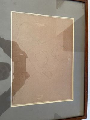 framed drawing of a man with a hat on his head in a wooden frame
