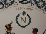 a plate with a picture of a man and a woman on it