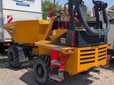 a yellow truck with a machine attached to it ' s back
