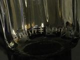 a close up of a clear glass vase on a table