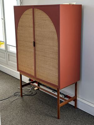 an image of a cabinet in a room with a window