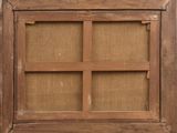 a window with a wooden frame on the outside of it