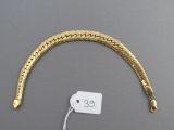 an image of a gold bracelet with a price tag attached to it
