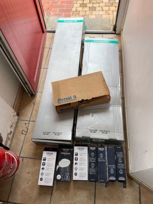 a lot of boxes on the floor next to a red door