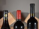 three bottles of wine sitting next to each other on a table