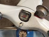 a close up of a motorcycle with a speedometer on the handlebar