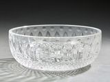 a glass bowl that is sitting on a table