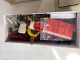 a box full of assorted items sitting on a table
