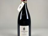 a bottle of wine that is sitting on a table