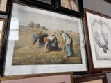 many framed pictures hanging on the wall of a room