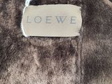a label that says loewe on the back of a stuffed animal