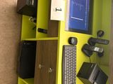 a yellow shelf that has a computer and a keyboard on it
