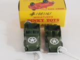 two toy army vehicles that are sitting next to each other