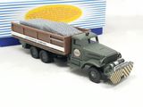 a toy truck with a bed on the back of it