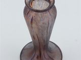 a glass vase that is sitting on a table