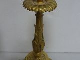 pair of antique brass candlesticks on a white background