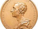 an image of a gold coin with a portrait of a man on it