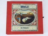 a red book with a picture of dali on it