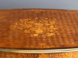 a large wooden table with a decorative design on it