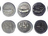 several different types of coins are shown on a white surface