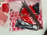 a plastic bag with scissors and other items on a table