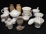 many different types of vases and bowls on the table