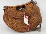 an image of a wicker purse with a tag on it