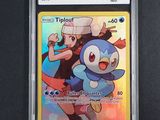 the pokemon trading card is in a plastic holder on a black surface