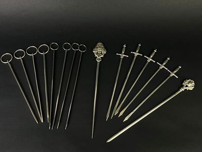 a set of six silver plated swords and a pair of scissors