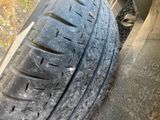 a close up of a tire on the side of a road