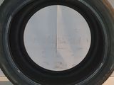 tire on a counter top with a white wall in the background