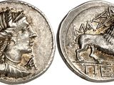 a silver coin with an image of a man and a horse on it