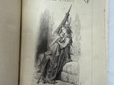 un vieux livre sur lequel figure le dessin d'une femme tenant un drapeau