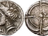 a silver coin with an image of a woman and a bird on it