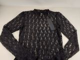a black lace top with long sleeves on a white background