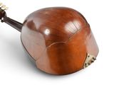 an image of a wooden instrument with a wooden body and a wooden neck