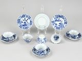 a group of blue and white dishes and cups and saucers