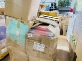 many boxes stacked on top of each other in a warehouse