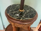 a table with a lamp on top of it in a room