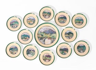 a lot of plates with pictures on them on the wall