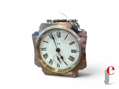 a small clock with roman numerals on the face