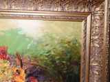 a picture of a painting of flowers in a gold frame