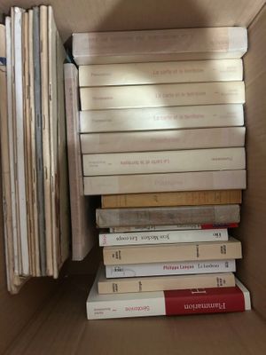 a box full of books sitting on the floor