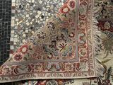 an image of a close up of a rug on a tiled floor