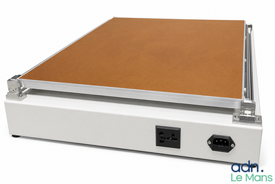 a white box with a brown cover sitting on top of it