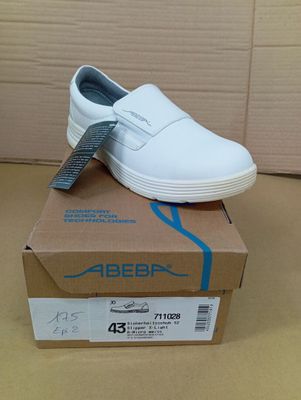 a white shoe that is on top of a box